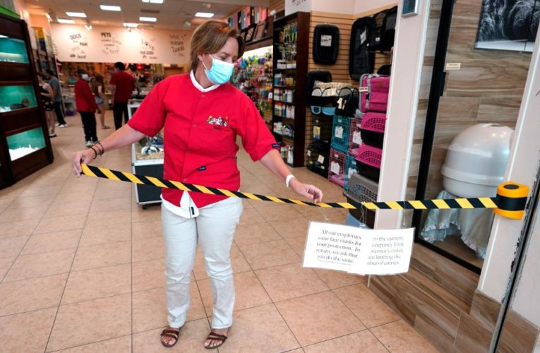 Employees are having to help enforce rules designed to keep their workplaces operating through the pandemic — occasionally with violent results