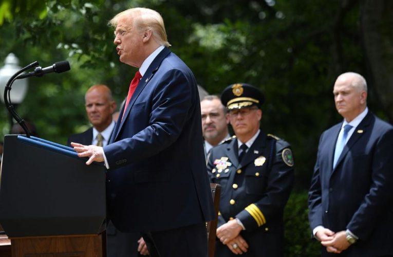 Trump defends police before signing executive action