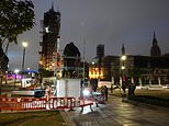 Workers BOARD UP the Cenotaph and Winston Churchill’s statue to protect them