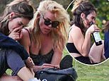 Raucous Lily James enjoys VERY boozy picnic with showbiz pals