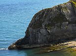 Day-tripper risks his life to take selfie on top of 150ft cliff at Durdle Door