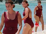 Coleen Rooney catches the eye in a burgundy swimsuit as she hits the beach in Barbados