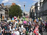 Thousands of Extinction Rebellion activists march on London as sun shines