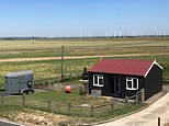 Beach chalet with just a corrugated tin roof on blustery Camber Sands hits market for £215,000