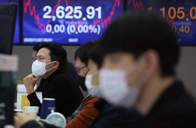 Asian shares fall despite fresh records on Wall Street