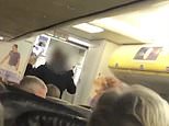 Moment Ryanair passengers CHEER as police arrest drunken thug