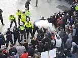 Protester launches firework at police officer’s FACE in Dublin city centre in anti-lockdown march 