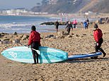 Shoppers hit the streets and sunworshippers take to the sea despite Covid lockdown