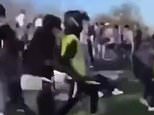 Moment knife-wielding thug charges at crowds during mass brawl