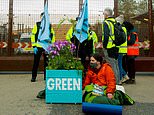 Extinction Rebellion protesters blockade nuclear base by locking themselves onto giant plant pots