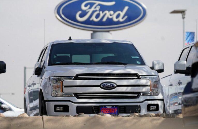 Ford posts profit, says chip shortage may cut production 50%