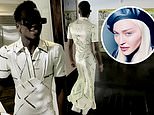 Madonna’s son David, 15, looks glamorous as he struts around the house in a dress