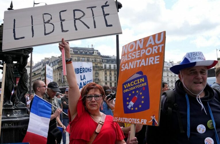 French police clash with anti-virus pass protesters in Paris