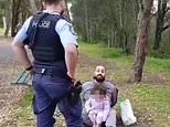 Little girl sits in her handcuffed father’s lap after he is arrested in Sydney Covid hotspot