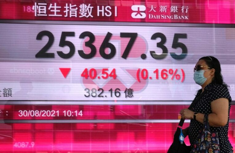 Asian shares mostly fall in muted trading amid virus worries