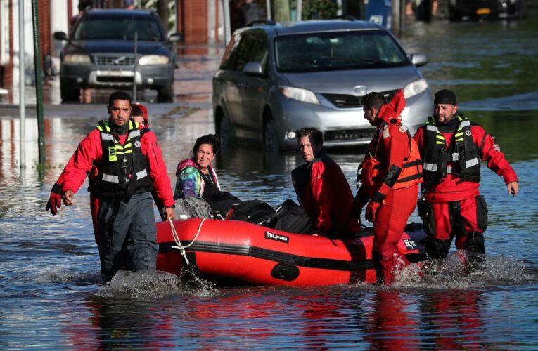 First responders rescued people stranded in flooded subway stations and motorists from roadways inundated with water after unprecedented rainfall