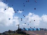 Dozens of tents float in sky like kites during strong winds at tourist hotspot in China