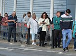 Panic buying is back! Shoppers queue to fill up trolleys with toilet roll and other essentials