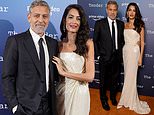 George Clooney cosies up to his wife Amal at The Tender Bar photocall at the London Film Festival