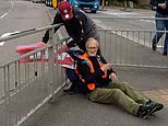 New video shows furious driver tying Insulate Britain activist to metal railings with his banner