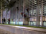 Animal rights activists climb Home Office and Defra building in London