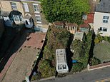 ‘Reclusive’ pensioner whose house was engulfed by greenery spends TWO DAYS cutting back the shrubs